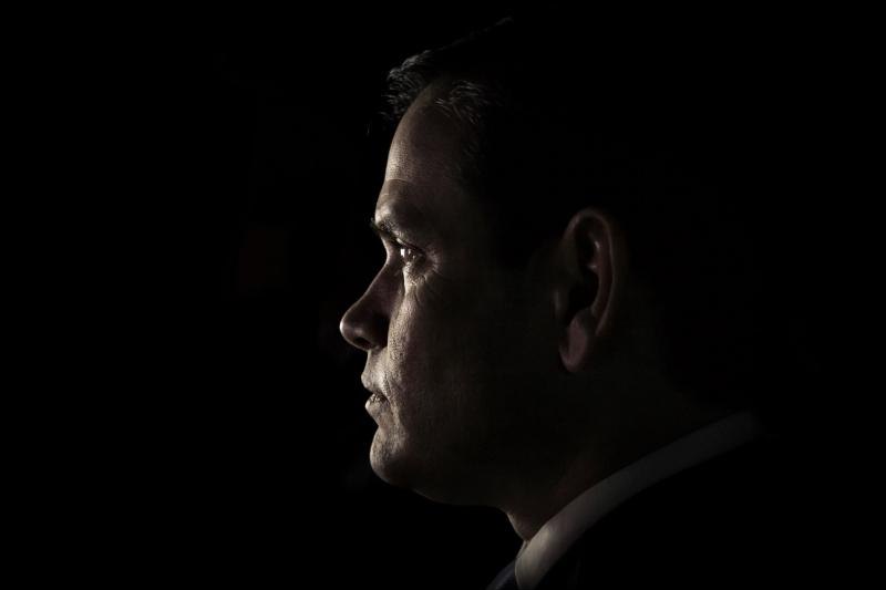 Profile of a leader lit against a dark background